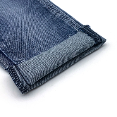 GX-AF B6024 Width: 178-180cm Weight: 9.6OZ Shrinkage: Warp:6-7% Weft:13-15% Weave: Right-hand twill Composition: 64.0% Cotton, 31.5% Tencel , 3.6% Rayon, 0.9% Spandex 10 count Slub yarn Super Sirospun TR dual core Medium stretch front view